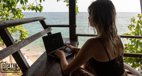 Digital Nomad working by the beach